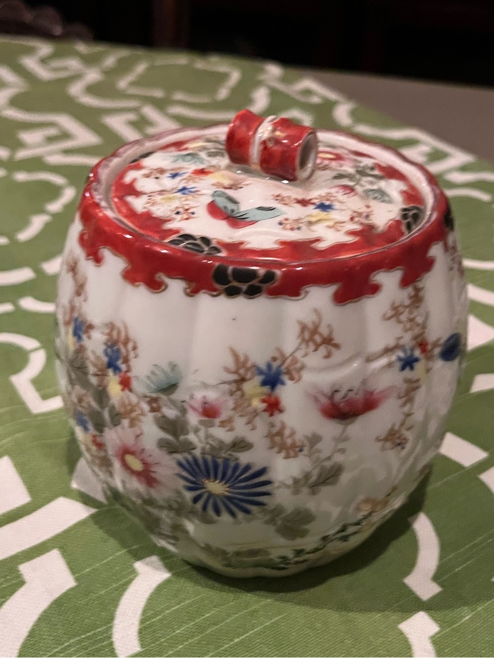 Decorative Floral Ceramic Jar with Red Accent Lid